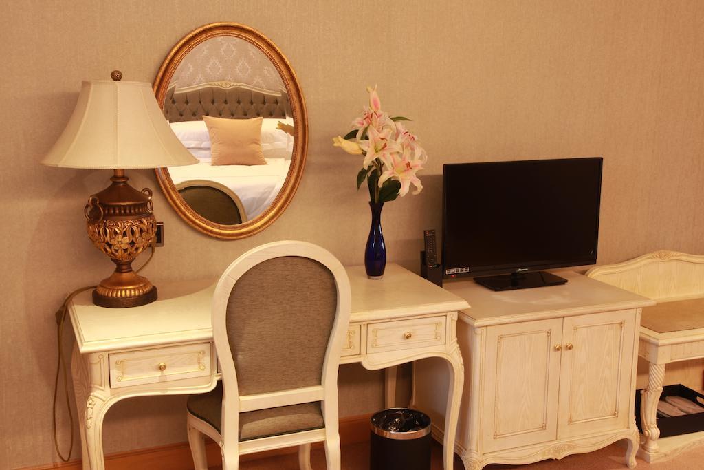 New Gloria Plaza Garden Hotel Charbin Pokoj fotografie